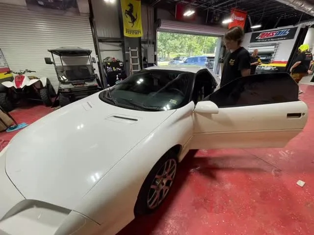White convertible in the tint bay